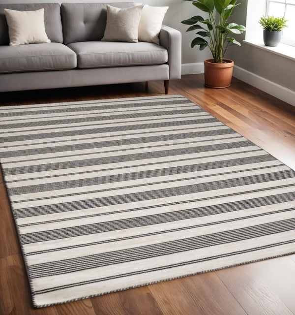 HomeRoots 4' Hand Woven Black and White Striped Area Rug - Eco-Friendly, Durable, and Stylish for Any Room 5' X 8' 511658