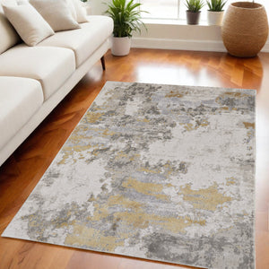 Homeroots 5' X 8' Ivory Gold And Gray Abstract Stain Resistant Area Rug Ivory,Gold,Gray Polypropylene 511785