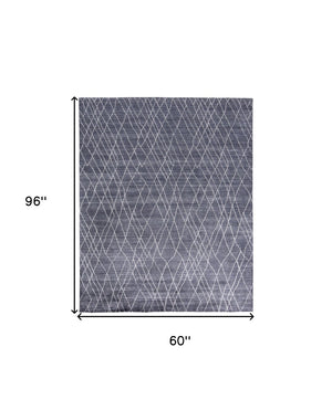 HomeRoots 5' Blue and Ivory Hand-Woven Abstract Area Rug - Artisan Crafted Elegance for Modern Spaces 5' X 8' 511916