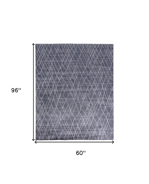 HomeRoots 5' Blue and Ivory Hand-Woven Abstract Area Rug - Artisan Crafted Elegance for Modern Spaces 5' X 8' 511916