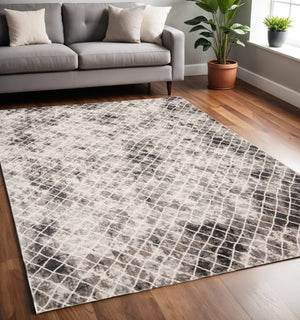 HomeRoots 4' Ivory Gray Taupe Abstract Area Rug - Stain Resistant, Modern Design for High-Traffic Spaces 5' X 8' 512072