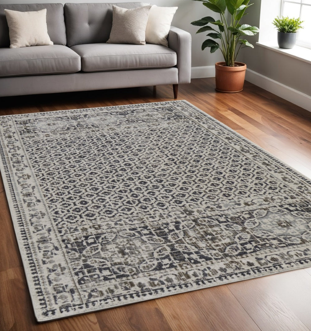 HomeRoots 4' Abstract Area Rug in Ivory, Taupe & Gray - Stain-Resistant, Modern Design for Durable Elegance 5' X 8' 512079