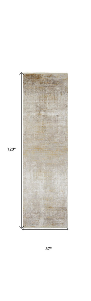 HomeRoots 3' Gold and Ivory Abstract Area Rug - Distressed Design with Decorative Fringe for Stylish Interiors 10' Runner 512111