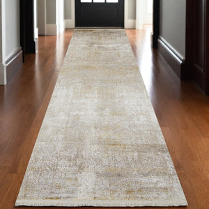 HomeRoots 3' Gold and Ivory Abstract Area Rug - Distressed Design with Decorative Fringe for Stylish Interiors 10' Runner 512111