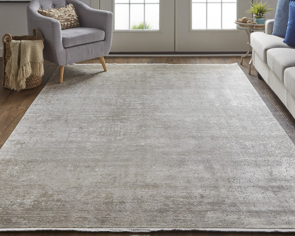 HomeRoots 3' Gold and Ivory Abstract Area Rug - Distressed Design with Decorative Fringe for Stylish Interiors 7' X 10' 512118