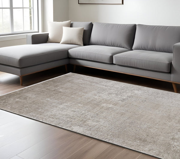 HomeRoots 3' Gold and Ivory Abstract Area Rug - Distressed Design with Decorative Fringe for Stylish Interiors 7' X 10' 512118