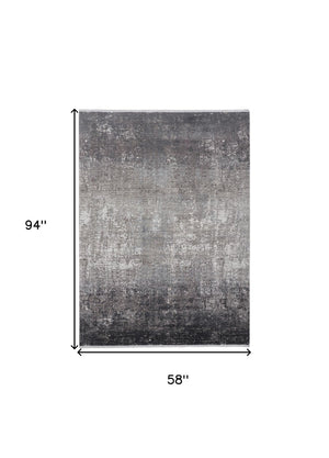 HomeRoots 3' Gold and Ivory Abstract Area Rug - Distressed Design with Decorative Fringe for Stylish Interiors 5' X 8' 512137