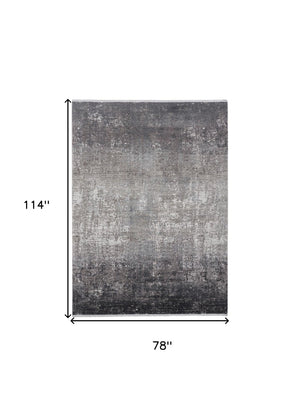 HomeRoots 3' Gold and Ivory Abstract Area Rug - Distressed Design with Decorative Fringe for Stylish Interiors 7' X 10' 512138