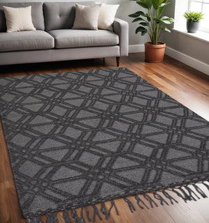HomeRoots 5' Hand Woven Wool Area Rug in Black and Gray Geometric Design with Fringed Edges for Modern Spaces 5' X 8' 512356
