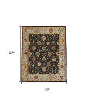 HomeRoots 4' Hand-Knotted Black and Gold Wool Oriental Area Rug with Fringed Edges for Timeless Elegance 5' x 8' 512597