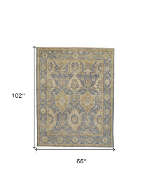 Homeroots 5' X 8' Blue Gold And Tan Wool Floral Hand Knotted Stain Resistant Area Rug With Fringe  Wool 512613