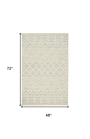 Homeroots 4' X 6' Ivory Blue And Tan Wool Geometric Tufted Handmade Stain Resistant Area Rug  Wool 512767