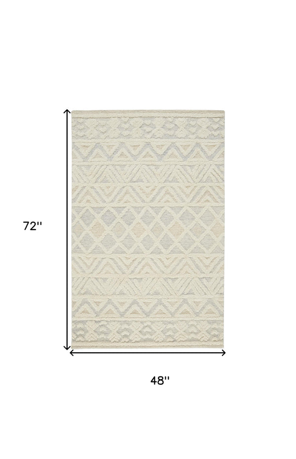 Homeroots 4' X 6' Ivory Blue And Tan Wool Geometric Tufted Handmade Stain Resistant Area Rug  Wool 512767