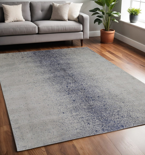 HomeRoots 5' Ivory and Blue Abstract Area Rug - Non-Skid, Power-Loomed Design for Contemporary Interiors 5' X 8' 512817