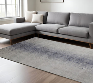 HomeRoots 5' Ivory and Blue Abstract Area Rug - Non-Skid, Power-Loomed Design for Contemporary Interiors 8' X 10' 512818