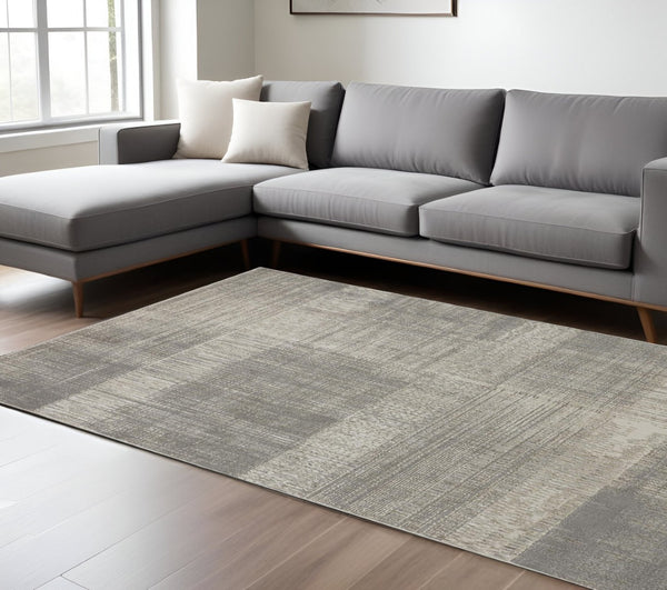 HomeRoots 4' Gray and Ivory Abstract Area Rug - Non-Skid Backing for Stability in Modern Living Spaces 7' X 10' 512959