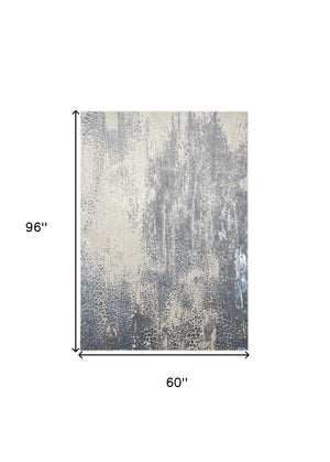 HomeRoots 4' Contemporary Abstract Area Rug in Ivory, Gray, and Blue – Elevate Your Living Space Elegantly 5' X 8' 512996