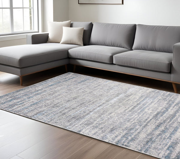 HomeRoots 4' Contemporary Ivory Gray and Blue Abstract Area Rug – Soft, Durable, and Stylish for Any Room 7' X 10' 513007