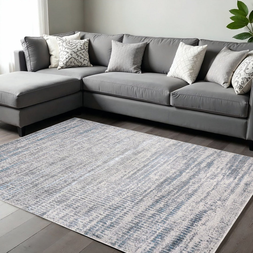 HomeRoots 4' Contemporary Ivory Gray and Blue Abstract Area Rug – Soft, Durable, and Stylish for Any Room 13' X 20' 513014