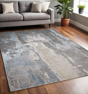 HomeRoots 4' Modern Abstract Area Rug in Gray, Ivory, and Blue - Stylish, Durable Design for Any Room 5' X 8' 513035
