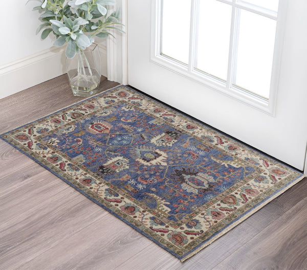 HomeRoots 4' Hand-Knotted Wool Area Rug with Blue and Red Floral Design - Durable, Stain-Resistant Beauty 2' X 3' 513093