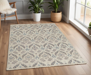 Homeroots 4' X 6' Gray And Ivory Wool Floral Hand Knotted Area Rug  Wool 513094