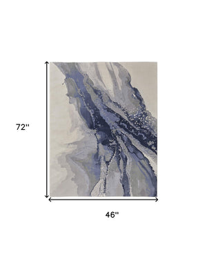 HomeRoots 4' Blue Gray and Ivory Abstract Area Rug - Stylish Modern Design for High-Traffic Spaces and Durability 4' X 6' 513169