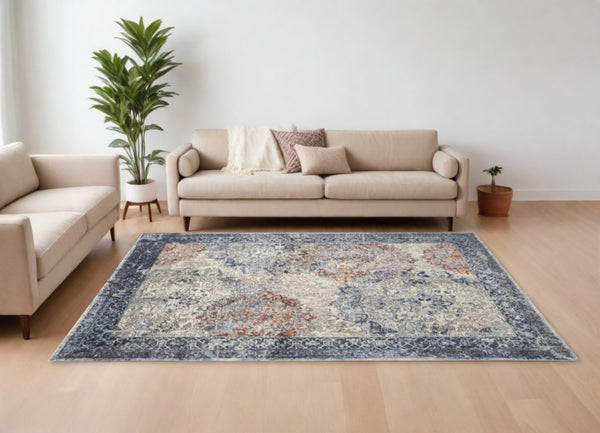Homeroots 8' X 11' Blue Ivory And Red Floral Power Loom Distressed Stain Resistant Area Rug  Polypropylene 513813