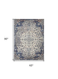 Homeroots 5' X 8' Ivory Gray And Blue Floral Power Loom Distressed Stain Resistant Area Rug  Polypropylene 513818