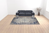 Homeroots 9' X 12' Ivory Gray And Blue Floral Power Loom Distressed Stain Resistant Area Rug  Polypropylene 513821