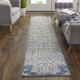 Homeroots 10' Ivory Gray And Blue Floral Power Loom Distressed Stain Resistant Runner Rug  Polypropylene 513823