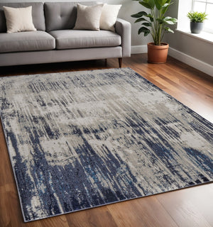 HomeRoots 4' Abstract Tan Blue Ivory Distressed Area Rug - Modern Power Loomed Design for Stylish Interiors 5' X 8' 513903
