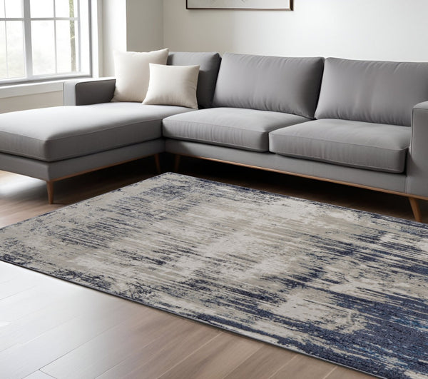 HomeRoots 4' Abstract Tan Blue Ivory Distressed Area Rug - Modern Power Loomed Design for Stylish Interiors 8' X 10' 513904