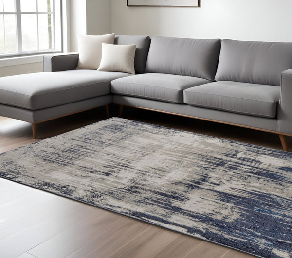 HomeRoots 4' Abstract Tan Blue Ivory Distressed Area Rug - Modern Power Loomed Design for Stylish Interiors 7' X 10' 513905