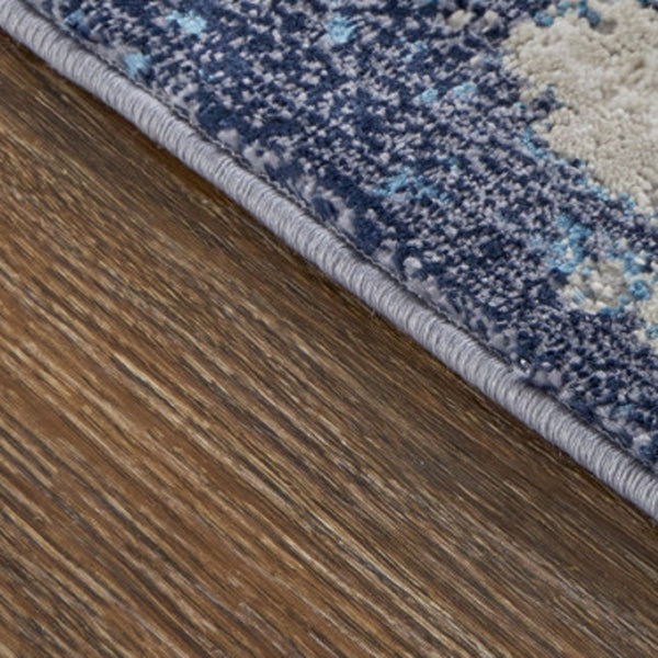HomeRoots 4' Abstract Tan Blue Ivory Distressed Area Rug - Modern Power Loomed Design for Stylish Interiors 7' X 10' 513905