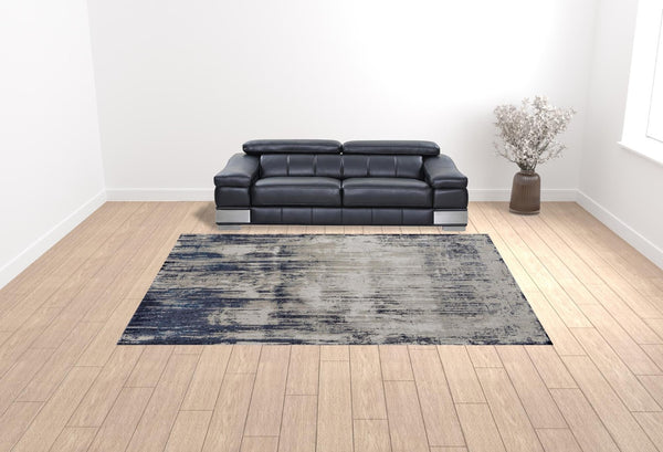HomeRoots 4' Abstract Tan Blue Ivory Distressed Area Rug - Modern Power Loomed Design for Stylish Interiors 10' X 13' 513907