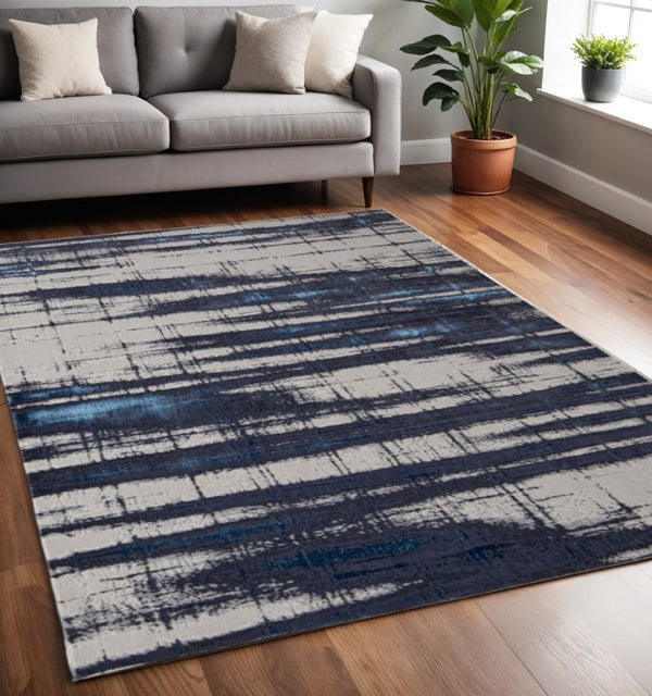 HomeRoots 4' Stylish Ivory and Blue Abstract Area Rug – Durable Power-Loomed Design for Modern Living Spaces 5' X 8' 513911