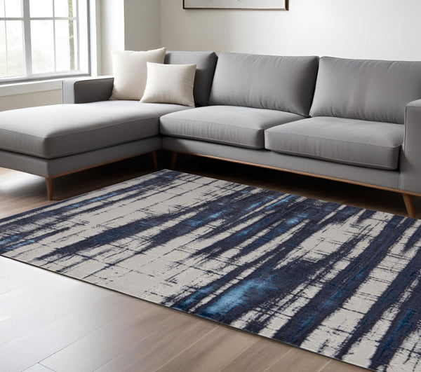 HomeRoots 4' Stylish Ivory and Blue Abstract Area Rug – Durable Power-Loomed Design for Modern Living Spaces 7' X 10' 513913