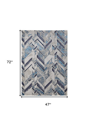 Homeroots 4' X 6' Ivory And Blue Chevron Power Loom Distressed Area Rug  Polypropylene,Polyester 513926