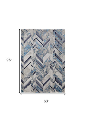 Homeroots 5' X 8' Ivory Blue And Gray Chevron Power Loom Distressed Area Rug  Polyester 513927