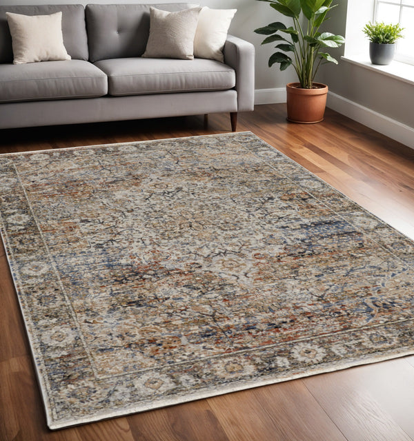 Homeroots 5' X 8' Tan And Blue Floral Power Loom Distressed Non Skid Area Rug With Fringe  Polypropylene 513966
