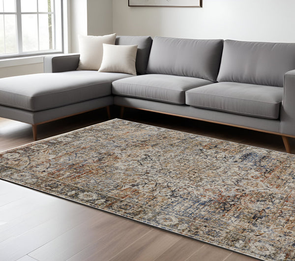 Homeroots 8' X 10' Tan And Blue Floral Power Loom Distressed Non Skid Area Rug With Fringe  Polypropylene 513967