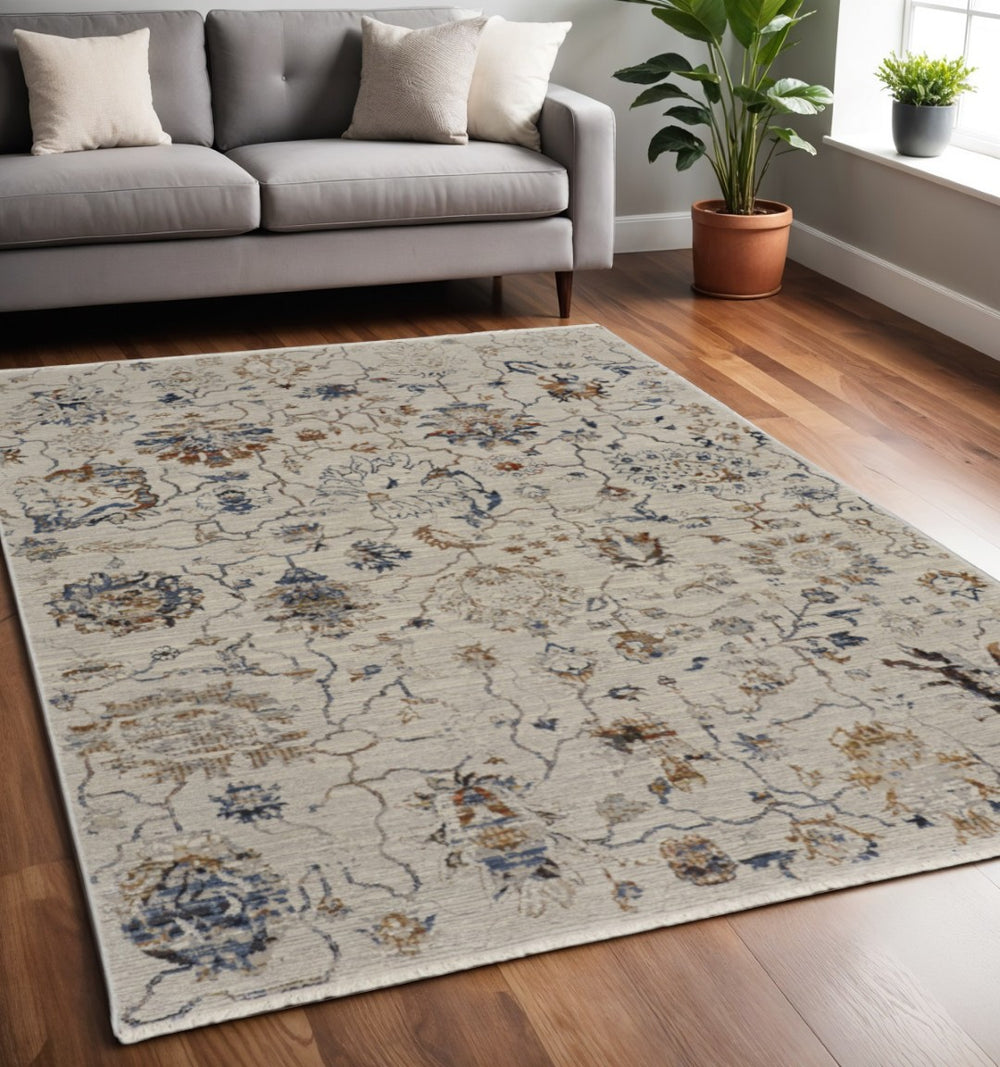 HomeRoots 5' Elegant Distressed Floral Area Rug in Ivory, Blue & Burnt Orange - Cozy Vintage Charm for Home 5' X 8' 513982