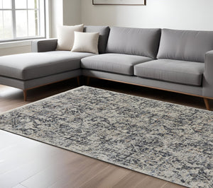 HomeRoots 8' Gray and Ivory Abstract Power Loom Area Rug with Fringed Edges for Modern Living Spaces 8' X 10' 514007