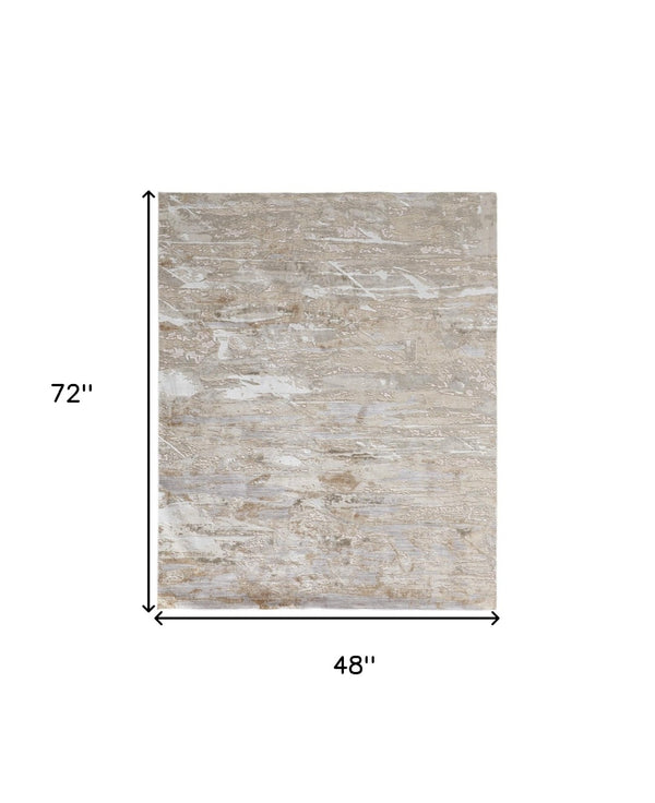 HomeRoots 4' Enhance Your Space with a Tan Ivory and Blue Abstract Distressed Area Rug for Modern Decor 4' X 6' 514140