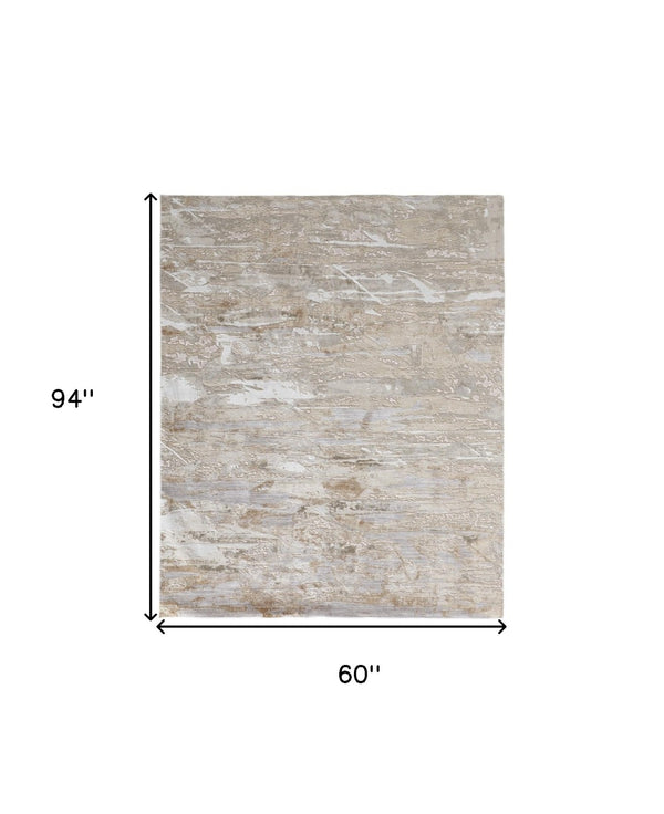 HomeRoots 4' Enhance Your Space with a Tan Ivory and Blue Abstract Distressed Area Rug for Modern Decor 5' X 8' 514141