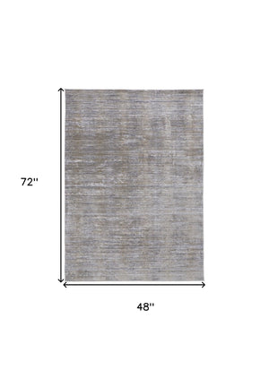 HomeRoots 4' Modern Abstract Area Rug in Taupe, Silver, and Tan - Durable Power Loomed Design for Any Space 4' X 6' 514194