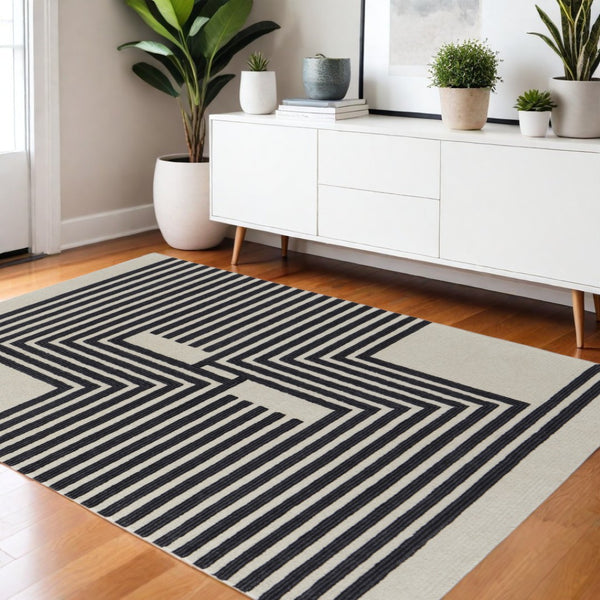HomeRoots 4' Gray and Black Abstract Geometric Wool Area Rug – Hand-Tufted Artisan Design for Modern Spaces 4' X 6' 514379