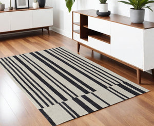 HomeRoots 4' Luxurious Ivory and Black Hand-Tufted Wool Abstract Area Rug for Modern Home Décor Elegance 4' X 6' 514386