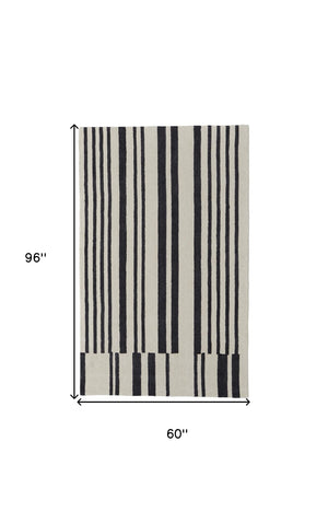 HomeRoots 4' Luxurious Ivory and Black Hand-Tufted Wool Abstract Area Rug for Modern Home Décor Elegance 5' X 8' 514387